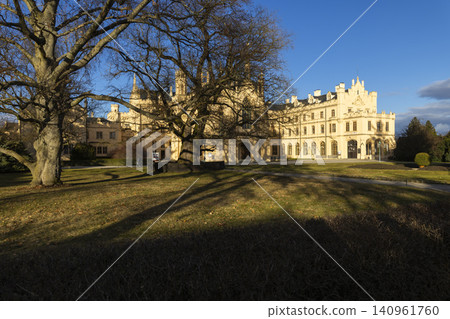 Lednice Palace neo Gothic architecture with long shadows Lednice Palace neo Gothic architecture with long shadows 140961760