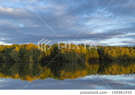 Autumn trees reflecting in calm pond water, Chlum u Trebone Autumn trees reflecting in calm pond water, Chlum u Trebone 140961930