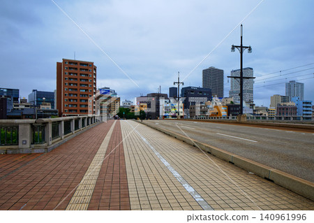 The Saiwai Bridge over the Asuwa River and the surrounding townscape The Saiwai Bridge over the Asuwa River and the surrounding townscape 140961996