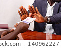 businessman refusing offers of banknotes from men. 140962227