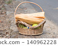 food basket placed on the ground. 140962228