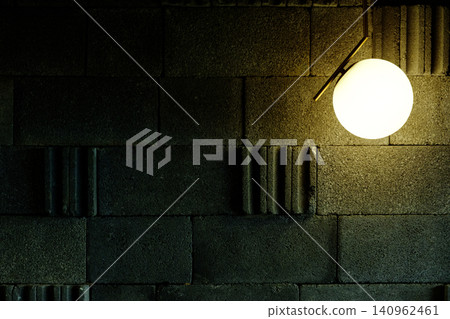 Modern Globe Pendant Light on Textured Grey Concrete Brick Wall Background Modern Globe Pendant Light on Textured Grey Concrete Brick Wall Background 140962461
