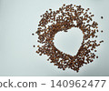 Heart made of coffee beans on a blue background. Copyspace. 140962477
