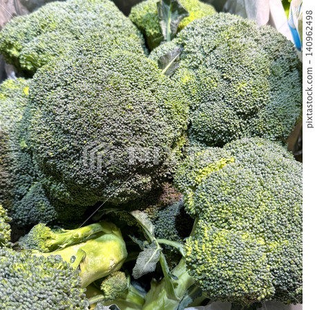 Plate of fresh green broccoli florets. Table spin Plate of fresh green broccoli florets. Table spin 140962498