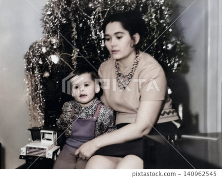 Retro family portrait of young mother with little son, Dnepropetrovsk, Ukrainian SSR, USSR - January 1, 1971 140962545