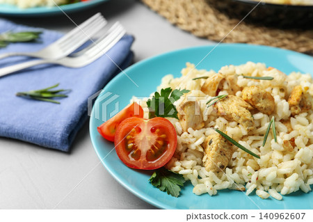 Delicious chicken risotto served on grey table Delicious chicken risotto served on grey table 140962607