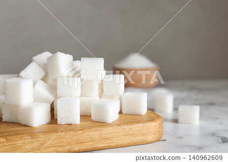Refined sugar cubes on white marble table 140962609