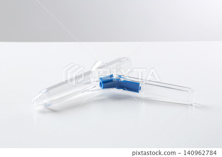 Medical anoscope isolated on white. Hemorrhoid treatment Medical anoscope isolated on white. Hemorrhoid treatment 140962784