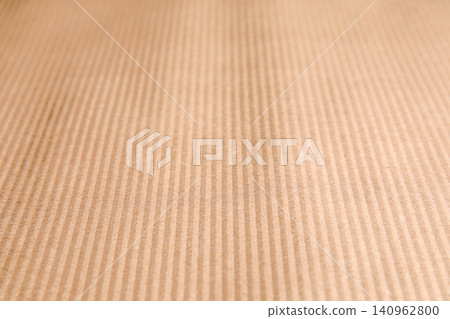 Brown corrugated sheet of cardboard as background, closeup Brown corrugated sheet of cardboard as background, closeup 140962800