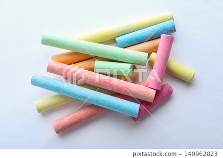 Color pieces of chalk on white background, top view Color pieces of chalk on white background, top view 140962823