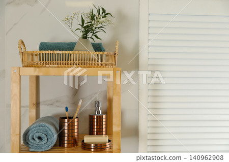 Shelving unit with toiletries in stylish bathroom interior 140962908