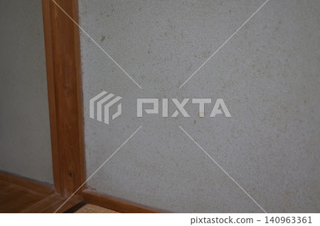 Mold stains on the mud walls of an old house. Humidity control and deterioration. White wall surface. Mold stains on the mud walls of an old house. Humidity control and deterioration. White wall surface. 140963361