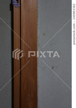 Mold stains on the mud walls of an old house. Blackening due to humidity. Deterioration and damage. Mold stains on the mud walls of an old house. Blackening due to humidity. Deterioration and damage. 140963362