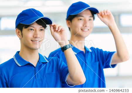 A young worker from the transportation company greets you. A young worker from the transportation company greets you. 140964233