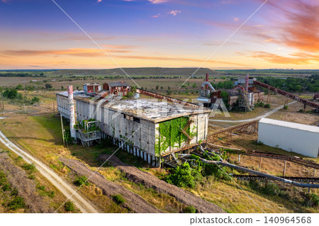 Industrial ruins of former phosphate mining plant in central Florida with old infrastructure and corroded metal structure. Industrial ruins of former phosphate mining plant in central Florida with old infrastructure and corroded metal structure. 140964568