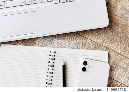 Workspace with a laptop and smartphone 140964738