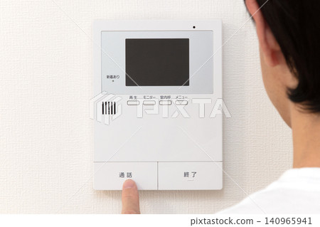 The hands of the person operating the intercom The hands of the person operating the intercom 140965941