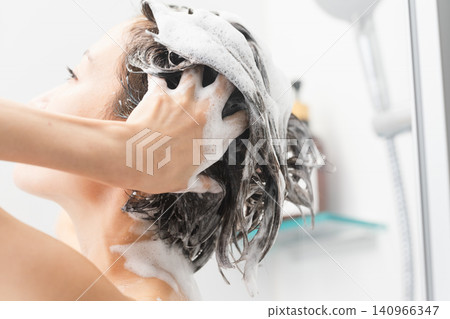 Woman shampooing beauty image Woman shampooing beauty image 140966347