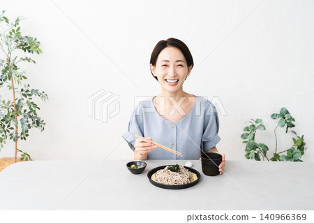 Woman eating Zaru Soba noodles Lifestyle image Woman eating Zaru Soba noodles Lifestyle image 140966369