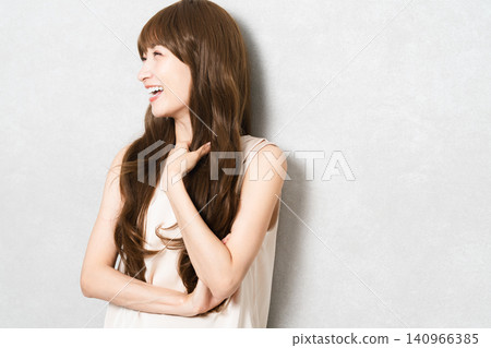 Posing long-haired woman beauty image Posing long-haired woman beauty image 140966385