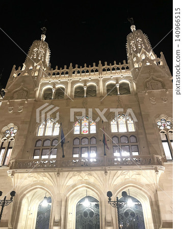 Neo-Gothic Building in Hungary at Night - Illuminated Historic Architecture with Towers Neo-Gothic Building in Hungary at Night - Illuminated Historic Architecture with Towers 140966515