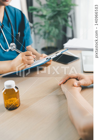 Doctor writing medical notes during patient consultation with prescription medicine bottle on table, healthcare service, medication advice, treatment plan, and pharmacy concept. 140966583