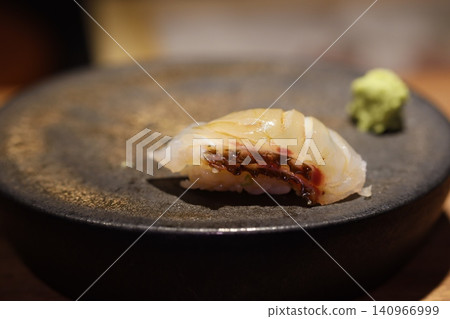Sushi with Wasabi on Dark Plate Sushi with Wasabi on Dark Plate 140966999