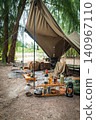 A rugged, masculine solo camping style, functionally set up amidst beautiful trees. 140967110