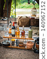 Bottle rack and camping gear for coffee and alcohol to create a luxurious moment to enjoy outdoors. 140967152