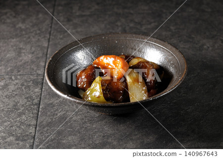 A single serving of sweet and sour pork with black vinegar, containing carrots, onions, bell peppers, and pork shoulder. A single serving of sweet and sour pork with black vinegar, containing carrots, onions, bell peppers, and pork shoulder. 140967643