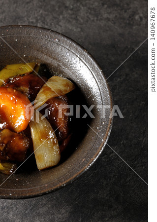 A single serving of sweet and sour pork with black vinegar, containing carrots, onions, bell peppers, and pork shoulder. A single serving of sweet and sour pork with black vinegar, containing carrots, onions, bell peppers, and pork shoulder. 140967678