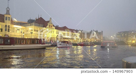 Amsterdam: Central Station and canals as seen from a cruise ship [Netherlands] 140967903