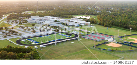 Public high school open air sports facilities in North Port, Florida. American football stadium, tennis courts and baseball diamond sport infrastructure Public high school open air sports facilities in North Port, Florida. American football stadium, tennis courts and baseball diamond sport infrastructure 140968137