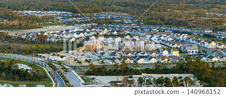 Construction in new developing suburban area. Development of residential housing in American suburbs. Real estate market in the USA Construction in new developing suburban area. Development of residential housing in American suburbs. Real estate market in the USA 140968152
