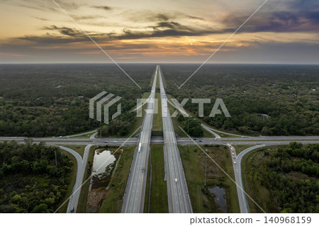 American highway bridge with fast moving traffic in evening. Interstate transportation concept American highway bridge with fast moving traffic in evening. Interstate transportation concept 140968159