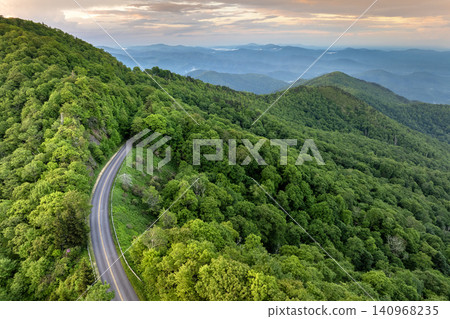 Car road trip on Blue Ridge Parkway in North Carolina Appalachian mountains in summer season at sunset. Summertime landscape of beautiful nature Car road trip on Blue Ridge Parkway in North Carolina Appalachian mountains in summer season at sunset. Summertime landscape of beautiful nature 140968235