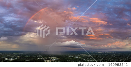Sunset sky over dark land. Bright colorful orange and yellow clouds. Panoramic skyscape 140968241