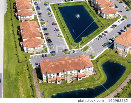 Contemporary condominiums in Florida suburban area, example of American residential development and lifestyle housing Contemporary condominiums in Florida suburban area, example of American residential development and lifestyle housing 140968285