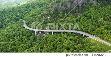 Linn Cove Viaduct road bridge in North Carolina Appalachian mountains, USA. Blue Ridge Parkway American highway in summer rain season Linn Cove Viaduct road bridge in North Carolina Appalachian mountains, USA. Blue Ridge Parkway American highway in summer rain season 140968329