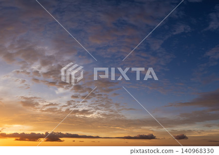 Bright colorful orange and yellow clouds on horizon. Beautiful sunset sky scenery Bright colorful orange and yellow clouds on horizon. Beautiful sunset sky scenery 140968330