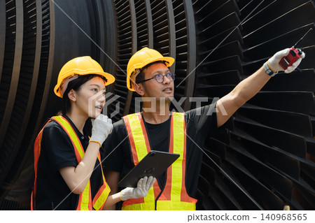 Professional engineers team working service power plant turbine fan blade electrical generator Professional engineers team working service power plant turbine fan blade electrical generator 140968565