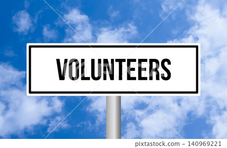 Volunteers road sign on cloudy sky background 140969221