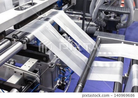 Plastic bag making machine, Packaging machinery, Plastic manufacturing, Industrial automation, Production line. Plastic bag making machine, Packaging machinery, Plastic manufacturing, Industrial automation, Production line. 140969686