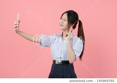 Portrait Thai student in uniform, Asian teen girl cute pretty cheerful happy smiling, Selfie action Portrait Thai student in uniform, Asian teen girl cute pretty cheerful happy smiling, Selfie action 140969768