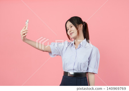 Portrait Thai student in uniform, Asian teen girl cute pretty cheerful happy smiling, Selfie action Portrait Thai student in uniform, Asian teen girl cute pretty cheerful happy smiling, Selfie action 140969769