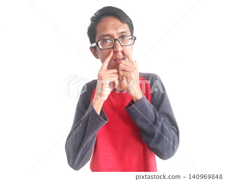 Energetic Asian Man in Batik Showing Hands with Surprised Expression Energetic Asian Man in Batik Showing Hands with Surprised Expression 140969848