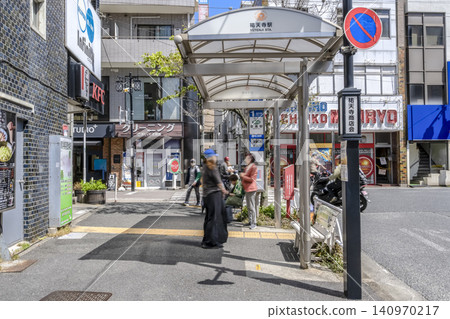Urban landscape of Meguro Ward, Tokyo: Bus stop and surrounding area in front of Yutenji Station Urban landscape of Meguro Ward, Tokyo: Bus stop and surrounding area in front of Yutenji Station 140970217