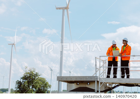Engineering teamwork outdoor, Wind farm survey, Power generator renewable technology, Site inspect Engineering teamwork outdoor, Wind farm survey, Power generator renewable technology, Site inspect 140970420