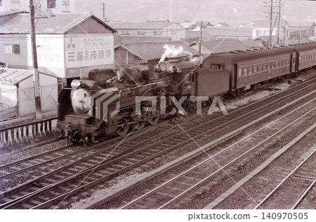 A local train pulled by a C58 steam locomotive. A local train pulled by a C58 steam locomotive. 140970505