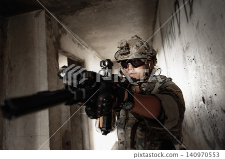 Special forces soldier aiming rifle, military tactical operation portrait Special forces soldier aiming rifle, military tactical operation portrait 140970553